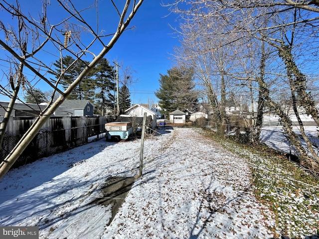 view of yard layered in snow