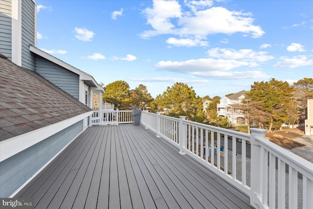 wooden terrace with a residential view