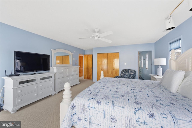 bedroom with carpet floors, a closet, and ceiling fan