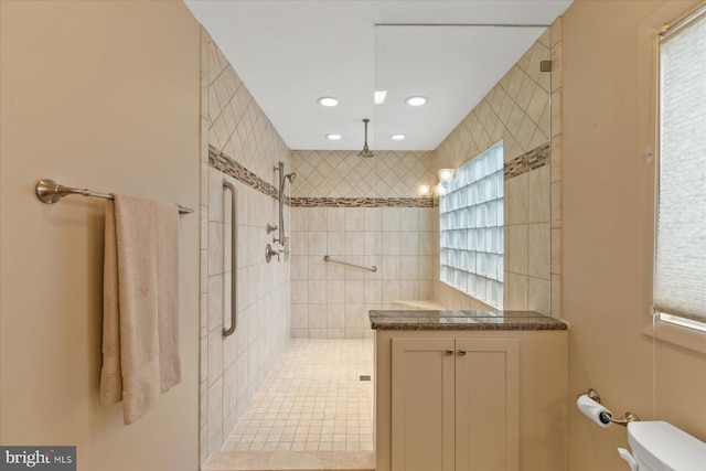 bathroom with toilet, a walk in shower, and recessed lighting