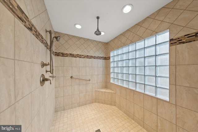 bathroom featuring tiled shower and recessed lighting