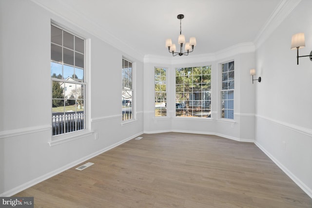 unfurnished sunroom featuring a notable chandelier