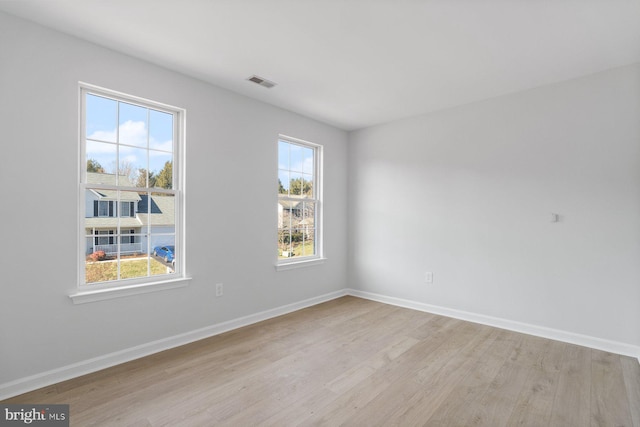 unfurnished room featuring light wood-type flooring