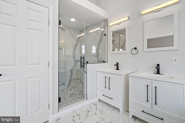 bathroom featuring vanity and a shower with door