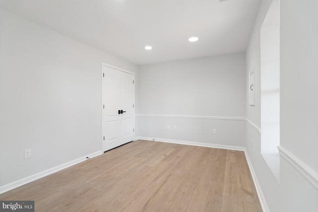 empty room with light wood-type flooring