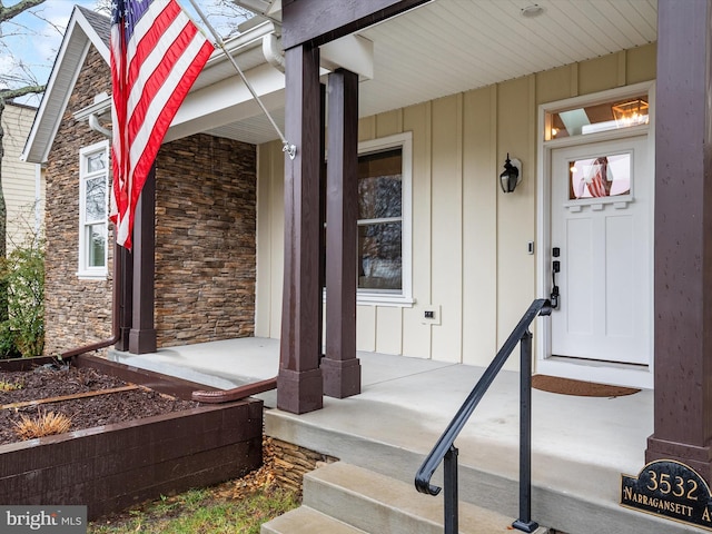 entrance to property featuring a porch