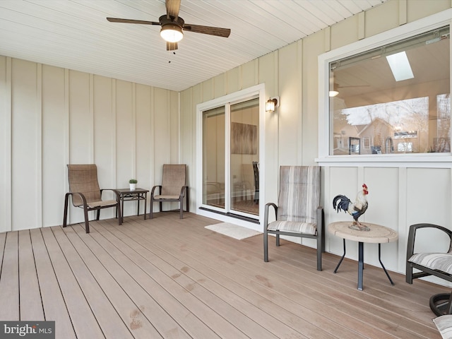 wooden deck with ceiling fan