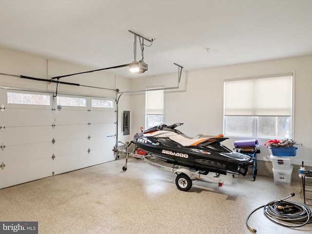 garage featuring a garage door opener and electric panel