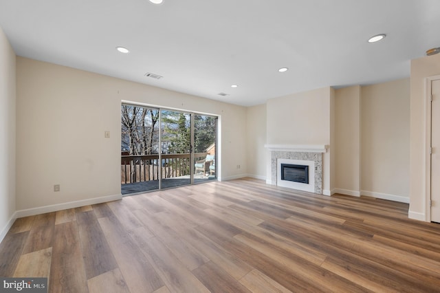 unfurnished living room with light hardwood / wood-style floors