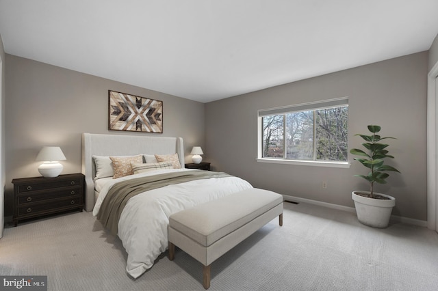 bedroom with light colored carpet