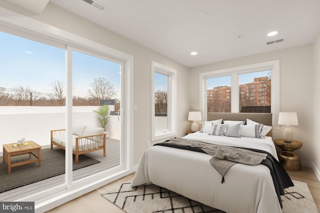 bedroom with light hardwood / wood-style flooring