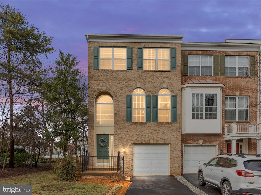 townhome / multi-family property featuring a garage