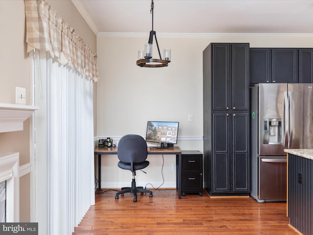 office with crown molding, a chandelier, and light hardwood / wood-style flooring