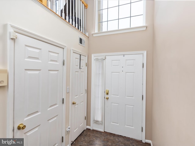 entryway featuring a high ceiling