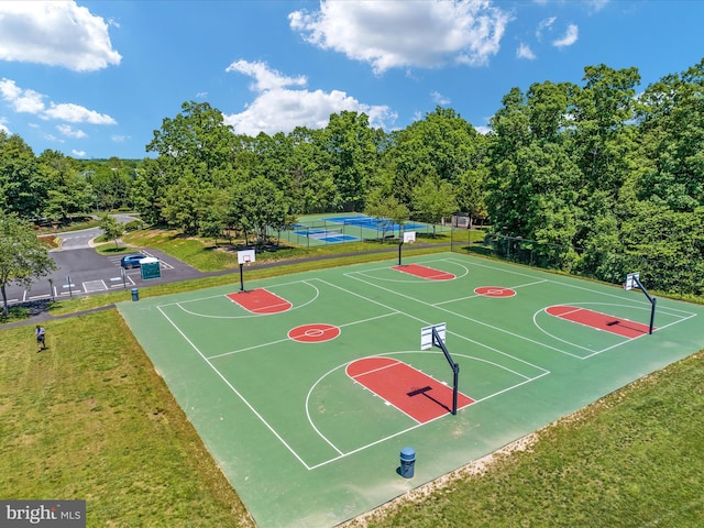 view of basketball court featuring a yard and tennis court