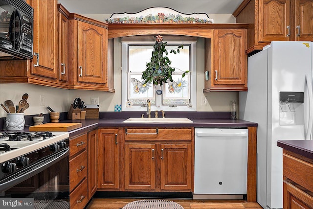 kitchen with white appliances and sink