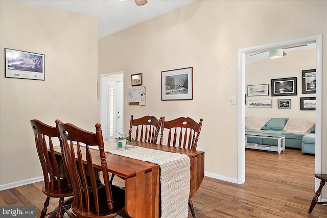 dining space featuring wood-type flooring