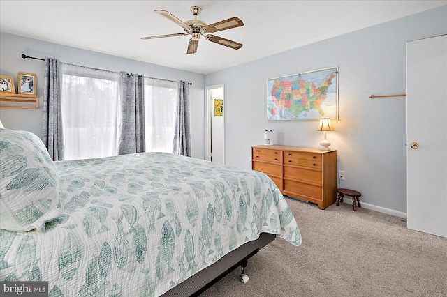 carpeted bedroom featuring ceiling fan