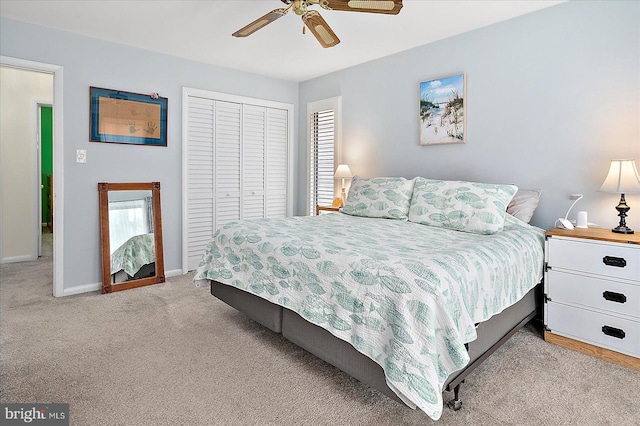 carpeted bedroom with a closet and ceiling fan