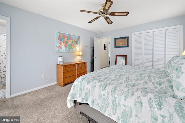 bedroom with ceiling fan, a closet, and light carpet