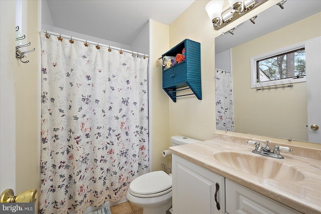 bathroom with a shower with curtain, tile patterned floors, vanity, and toilet