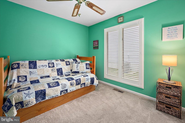 carpeted bedroom featuring ceiling fan