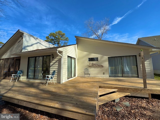 back of property featuring a deck