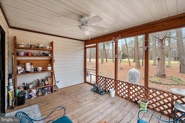 sunroom featuring ceiling fan, plenty of natural light, and wooden ceiling