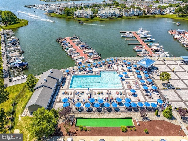 birds eye view of property with a water view