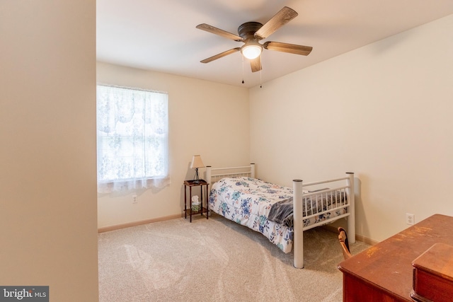 bedroom with ceiling fan and carpet