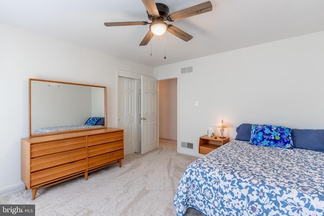 bedroom featuring ceiling fan and carpet