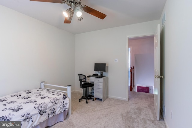 bedroom featuring ceiling fan and light carpet