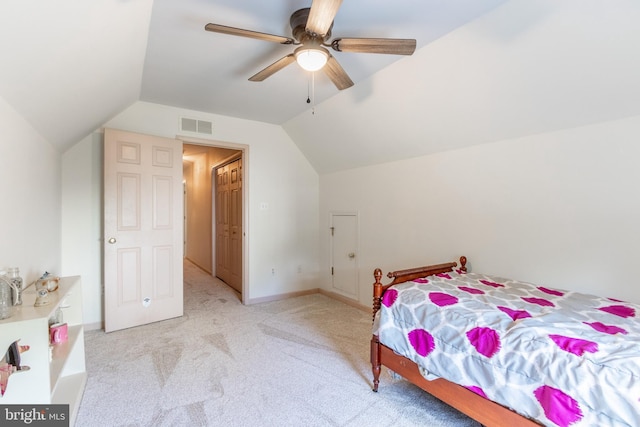 carpeted bedroom featuring lofted ceiling and ceiling fan