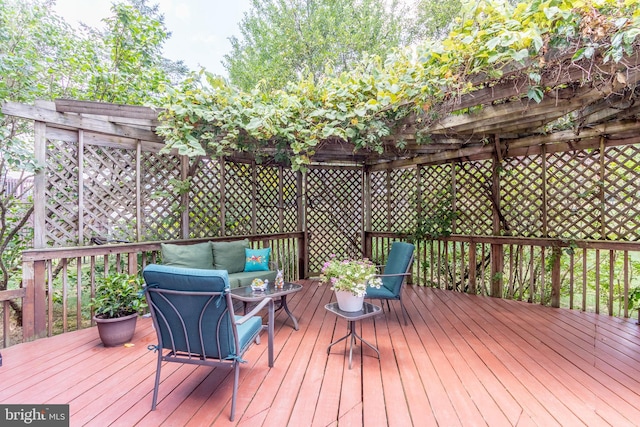 wooden deck featuring an outdoor living space