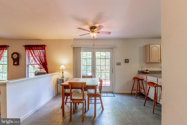 dining space featuring ceiling fan