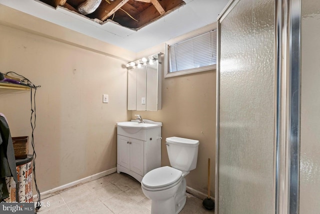 bathroom with vanity, a shower with door, tile patterned floors, and toilet