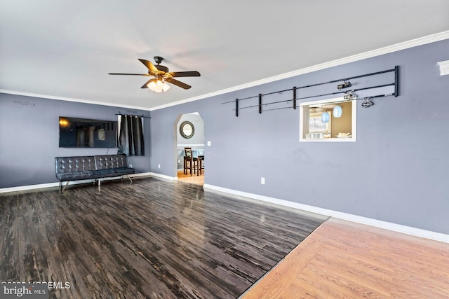 unfurnished living room featuring ornamental molding, hardwood / wood-style floors, and ceiling fan