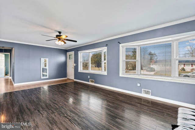 unfurnished room with hardwood / wood-style floors, ornamental molding, and ceiling fan