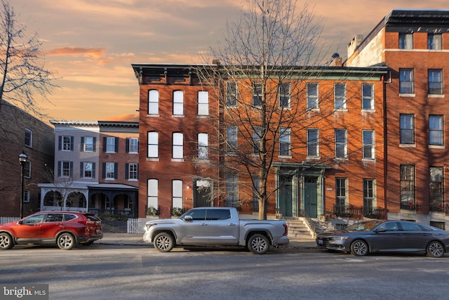 view of outdoor building at dusk