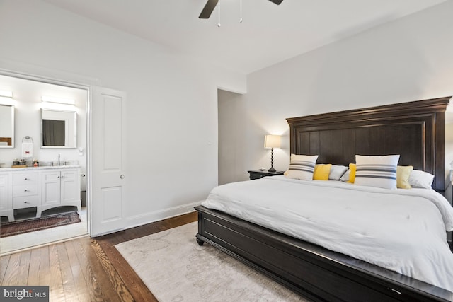 bedroom featuring sink, dark wood-type flooring, connected bathroom, and ceiling fan