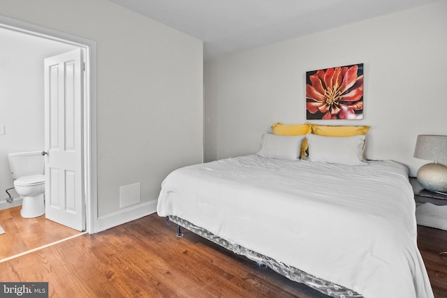 bedroom with hardwood / wood-style flooring