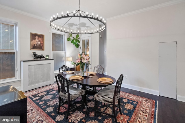 dining room featuring ornamental molding, a chandelier, and hardwood / wood-style floors