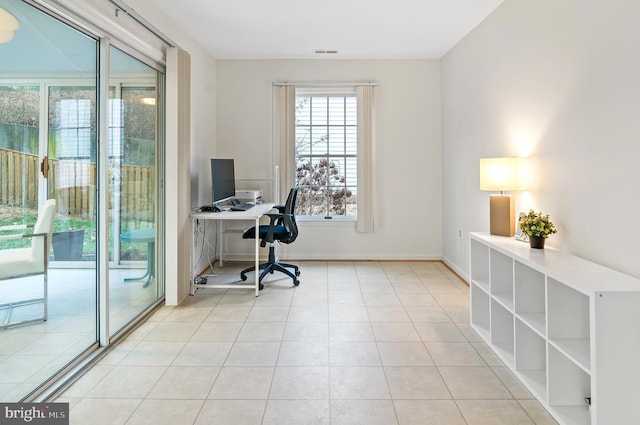 home office with light tile patterned floors