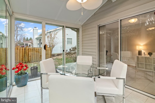 sunroom with vaulted ceiling and ceiling fan