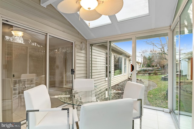 sunroom / solarium featuring lofted ceiling and ceiling fan