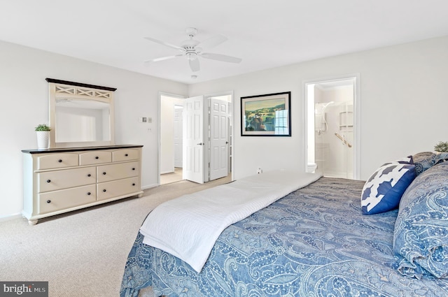 carpeted bedroom featuring connected bathroom and ceiling fan