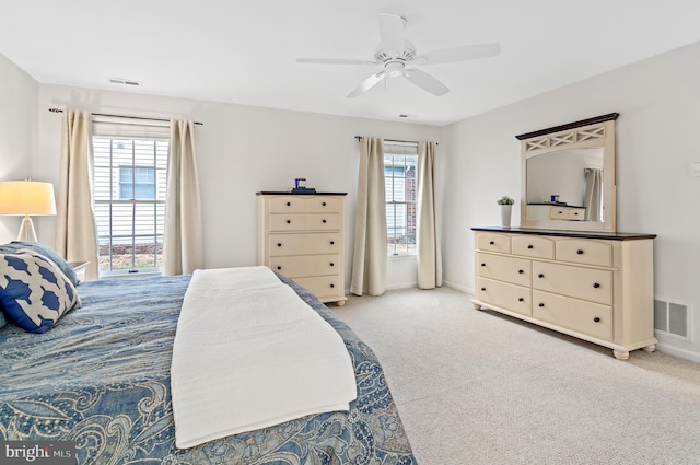 bedroom with light colored carpet and ceiling fan