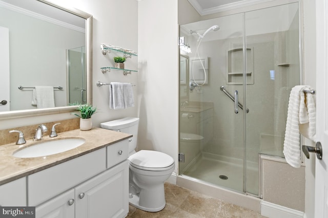 bathroom with ornamental molding, toilet, a shower with door, and vanity