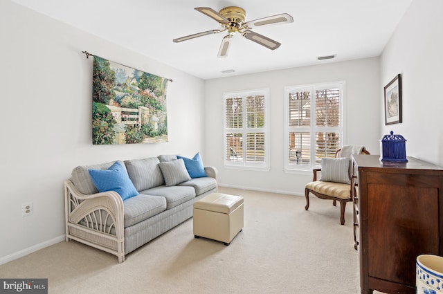 living room featuring light colored carpet and ceiling fan