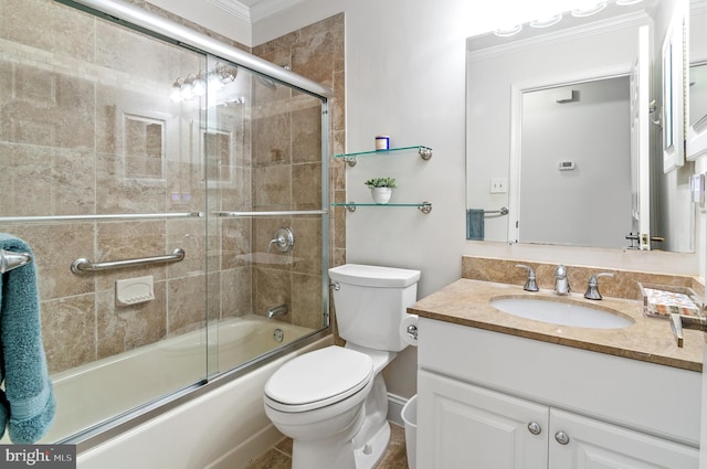 full bathroom featuring vanity, toilet, and combined bath / shower with glass door